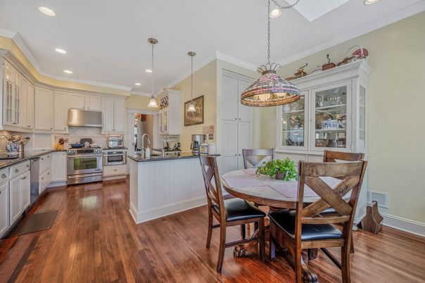 Dining room, Interior, Kitchen, Pendant Lights, Recessed Lighting, Stainless Steel Appliances, Wood Texture Flooring