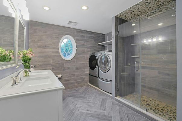 Bathroom, Glass Shower, Interior, Recessed Lighting, Washer, Wood Texture Flooring, Wooden Walls
