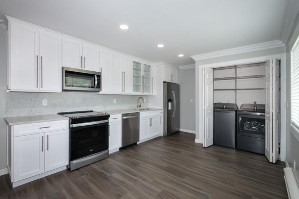 Interior, Kitchen, Recessed Lighting, Stainless Steel Appliances, Washer, Wood Texture Flooring