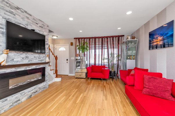 Fireplace, Interior, Living room, Recessed Lighting, Stone Walls, Wood Texture Flooring
