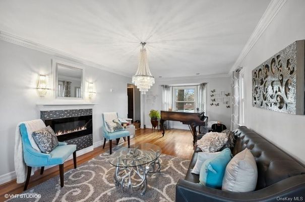 Chandelier, Fireplace, Interior, Living room, Piano, Wood Texture Flooring