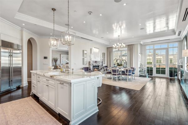 Chandelier, Dining room, Fireplace, Interior, Kitchen, Living room, Pendant Lights, Recessed Lighting, Stainless Steel Appliances, Wood Texture Flooring