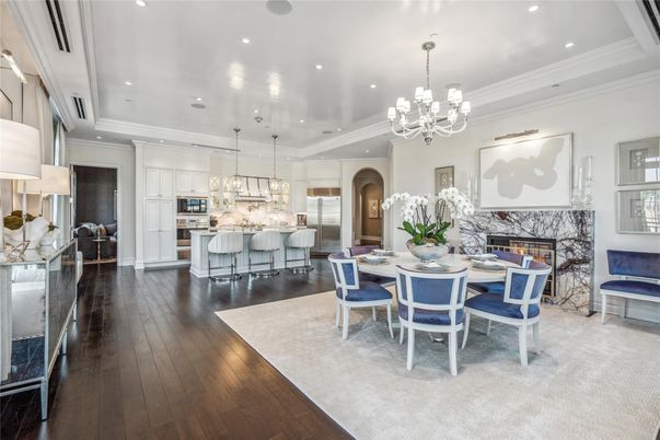 Chandelier, Dining room, Fireplace, Interior, Kitchen, Pendant Lights, Recessed Lighting, Stainless Steel Appliances, Wood Texture Flooring