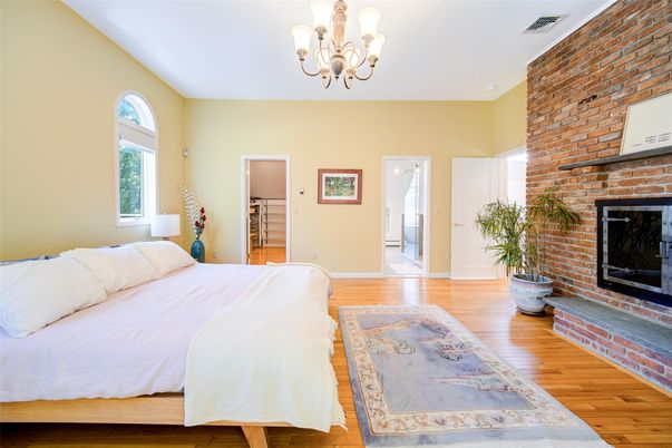 Bedroom, Chandelier, Fireplace, Interior, Stone Walls, Wood Texture Flooring