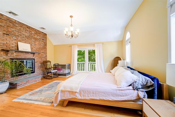 Bedroom, Chandelier, Fireplace, Interior, Stone Walls, Wood Texture Flooring