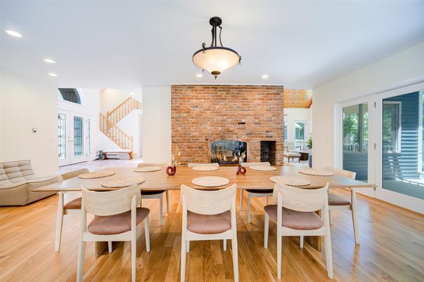 Dining room, Fireplace, Interior, Recessed Lighting, Stone Walls, Wood Texture Flooring