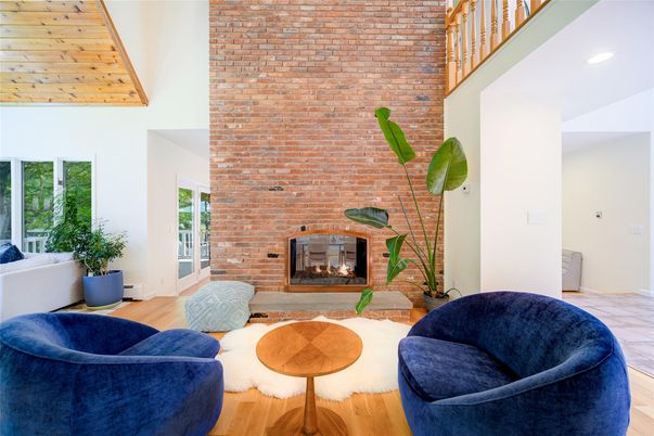 Fireplace, Interior, Living room, Recessed Lighting, Stone Walls, Wood Texture Flooring