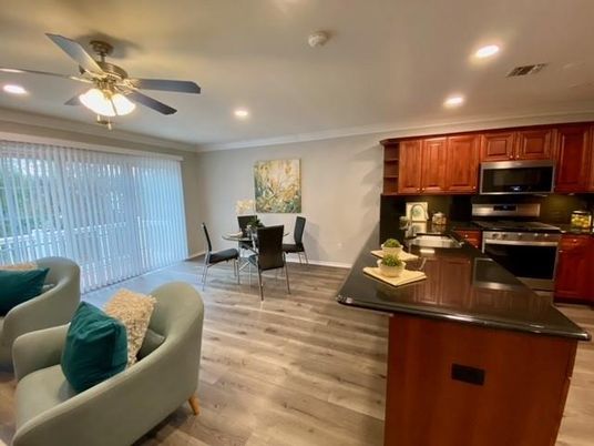 Dining room, Interior, Kitchen, Living room, Recessed Lighting, Stainless Steel Appliances, Wood Texture Flooring
