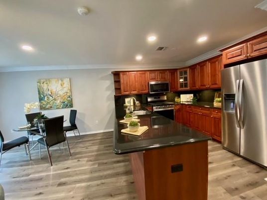 Dining room, Interior, Kitchen, Recessed Lighting, Stainless Steel Appliances, Wood Texture Flooring