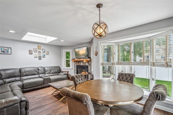 Dining room, Fireplace, Interior, Living room, Pendant Lights, Recessed Lighting, Wood Texture Flooring