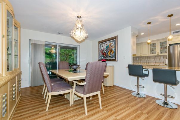Chandelier, Dining room, Interior, Kitchen, Pendant Lights, Recessed Lighting, Stainless Steel Appliances, Wood Texture Flooring