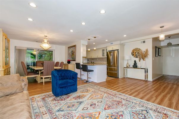 Chandelier, Dining room, Interior, Kitchen, Living room, Pendant Lights, Recessed Lighting, Stainless Steel Appliances, Wood Texture Flooring