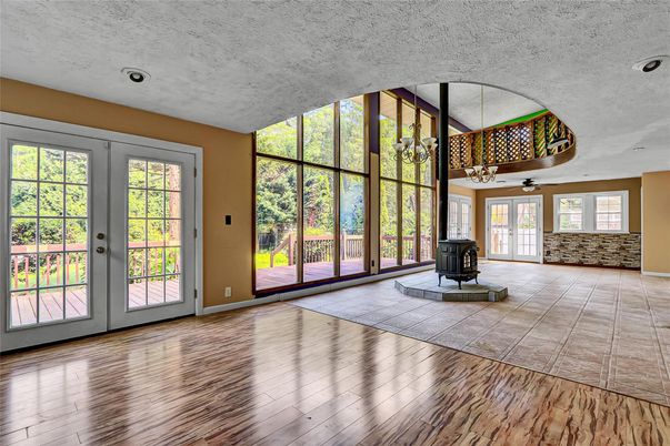 Chandelier, Empty room, Fireplace, Interior, Recessed Lighting, Wood Texture Flooring