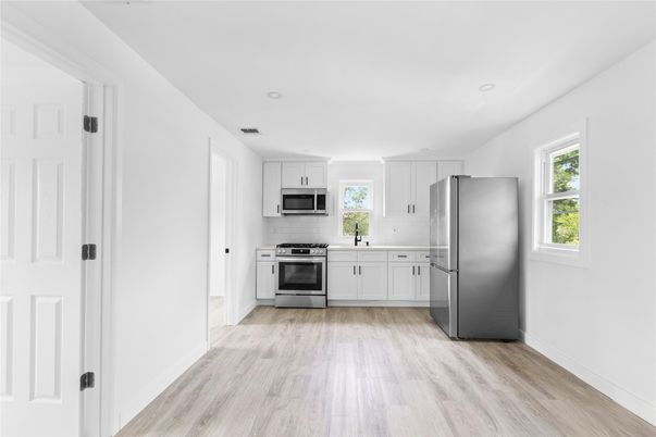 Interior, Kitchen, Recessed Lighting, Stainless Steel Appliances, Wood Texture Flooring