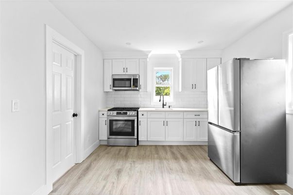 Interior, Kitchen, Recessed Lighting, Stainless Steel Appliances, Wood Texture Flooring