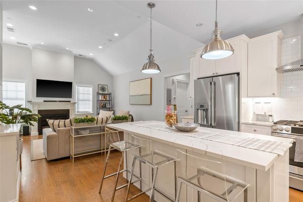 Fireplace, Interior, Kitchen, Living room, Pendant Lights, Recessed Lighting, Stainless Steel Appliances, Wood Texture Flooring