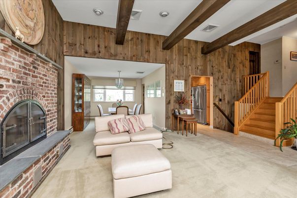 Chandelier, Dining room, Fireplace, Interior, Kitchen, Living room, Pendant Lights, Recessed Lighting, Stone Walls, Wooden Beams, Wooden Walls