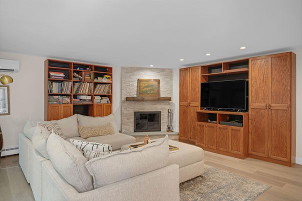 Fireplace, Interior, Living room, Recessed Lighting, Stone Walls, Wood Texture Flooring