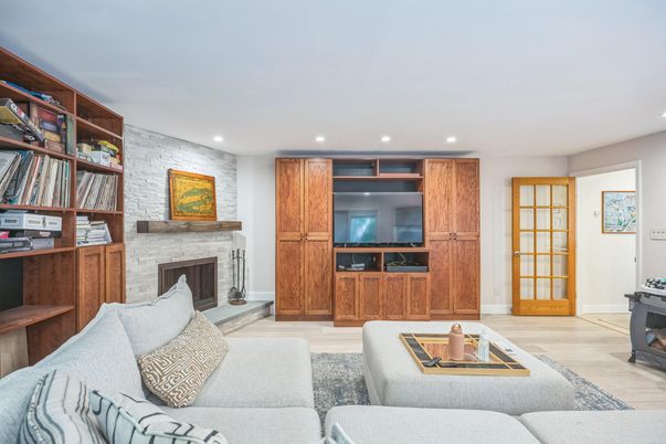 Fireplace, Interior, Living room, Recessed Lighting, Stone Walls, Wood Texture Flooring