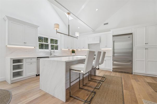 Interior, Kitchen, Marble Walls, Recessed Lighting, Stainless Steel Appliances, Wood Texture Flooring