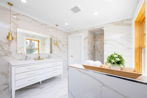Bathroom, Dual Sink Vanities, Interior, Marble, Marble Walls, Pendant Lights, Recessed Lighting