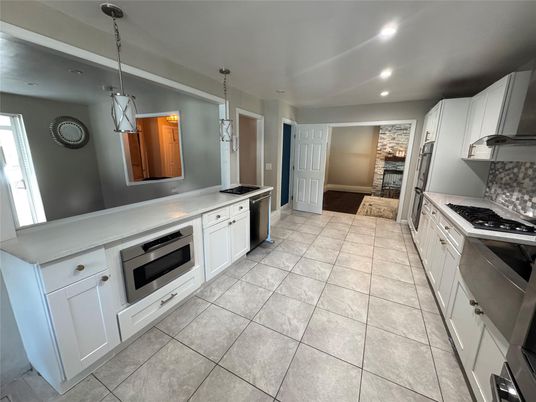 Fireplace, Interior, Kitchen, Pendant Lights, Recessed Lighting, Stainless Steel Appliances