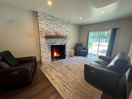 Fireplace, Interior, Living room, Recessed Lighting, Stone Walls, Wood Texture Flooring