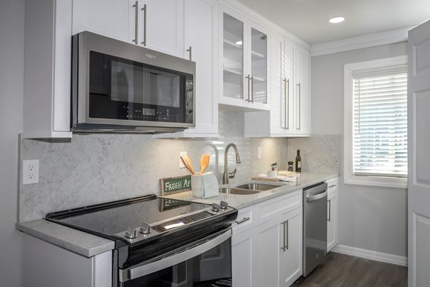 Interior, Kitchen, Marble Walls, Recessed Lighting, Stainless Steel Appliances, Wood Texture Flooring
