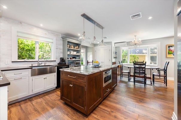 Chandelier, Dining room, Interior, Kitchen, Pendant Lights, Recessed Lighting, Stainless Steel Appliances, Wood Texture Flooring