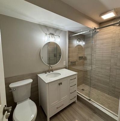 Bathroom, Dual Sink Vanities, Glass Shower, Interior, Wood Texture Flooring