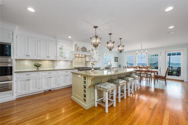Chandelier, Dining room, Interior, Kitchen, Pendant Lights, Recessed Lighting, Stainless Steel Appliances, Water, Wood Texture Flooring