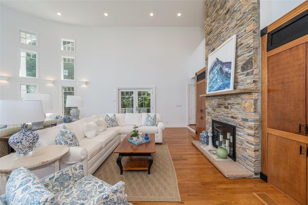 Fireplace, Interior, Living room, Recessed Lighting, Stone Walls, Wood Texture Flooring