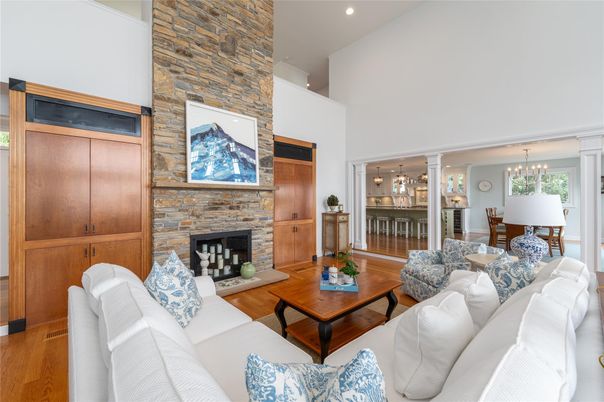 Chandelier, Dining room, Fireplace, Interior, Living room, Pendant Lights, Recessed Lighting, Stone Walls, Wood Texture Flooring