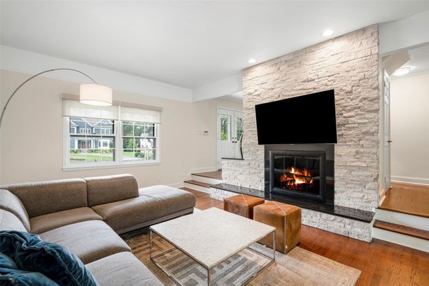 Fireplace, Interior, Living room, Recessed Lighting, Stone Walls, Wood Texture Flooring