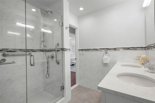 Bathroom, Dual Sink Vanities, Glass Shower, Interior, Marble Walls, Recessed Lighting