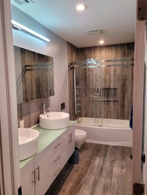 Bathroom, Dual Sink Vanities, Glass Shower, Interior, Recessed Lighting, Wood Texture Flooring