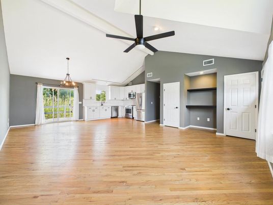Empty room, Interior, Kitchen, Pendant Lights, Recessed Lighting, Stainless Steel Appliances, Wood Texture Flooring