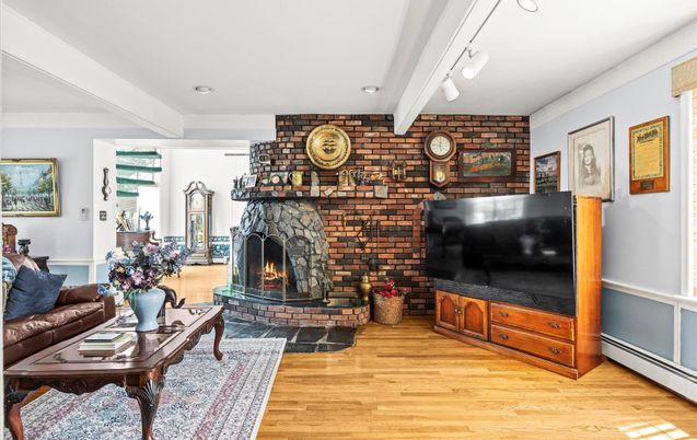 Fireplace, Interior, Living room, Recessed Lighting, Stone Walls, Wood Texture Flooring