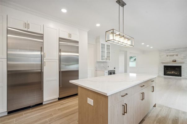 Fireplace, Interior, Kitchen, Pendant Lights, Recessed Lighting, Stainless Steel Appliances, Wood Texture Flooring