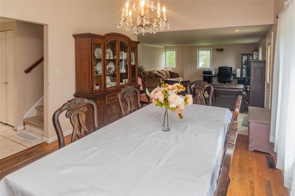 Chandelier, Dining room, Fireplace, Interior, Living room, Recessed Lighting, Wood Texture Flooring