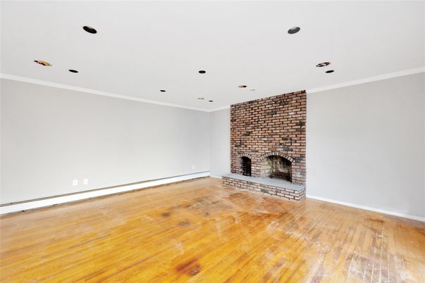 Empty room, Fireplace, Interior, Recessed Lighting, Stone Walls, Wood Texture Flooring