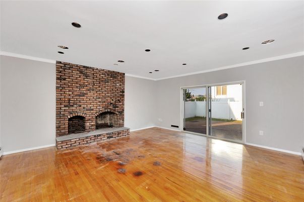 Empty room, Fireplace, Interior, Recessed Lighting, Stone Walls, Wood Texture Flooring