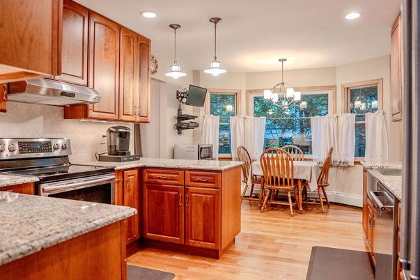 Dining room, Interior, Kitchen, Pendant Lights, Recessed Lighting, Stainless Steel Appliances, Wood Texture Flooring