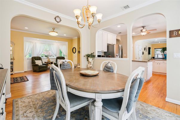 Chandelier, Dining room, Interior, Kitchen, Living room, Recessed Lighting, Stainless Steel Appliances, Wood Texture Flooring
