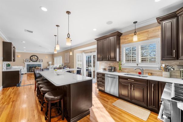 Dining room, Fireplace, Interior, Kitchen, Pendant Lights, Recessed Lighting, Stainless Steel Appliances, Wood Texture Flooring