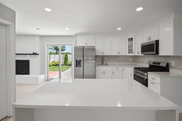 Fireplace, Interior, Kitchen, Recessed Lighting, Stainless Steel Appliances