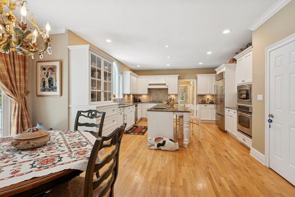Chandelier, Dining room, Interior, Kitchen, Recessed Lighting, Stainless Steel Appliances, Wood Texture Flooring