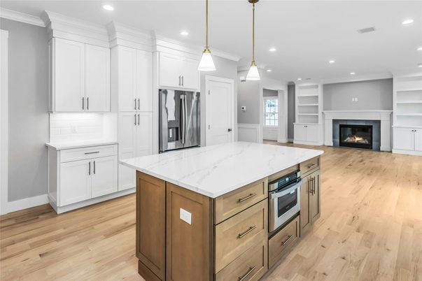 Fireplace, Interior, Kitchen, Pendant Lights, Recessed Lighting, Stainless Steel Appliances, Wood Texture Flooring