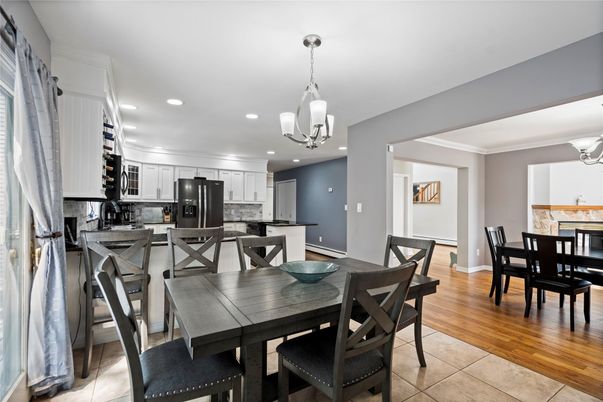 Chandelier, Dining room, Interior, Kitchen, Pendant Lights, Recessed Lighting, Stainless Steel Appliances, Wood Texture Flooring