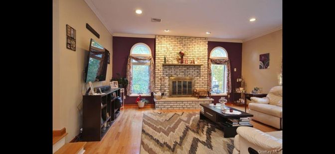 Fireplace, Interior, Living room, Recessed Lighting, Stone Walls, Wood Texture Flooring